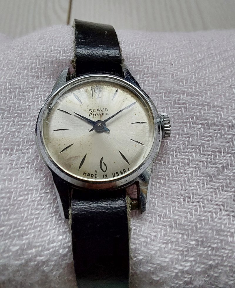 Slava vintage soviet watch with black leather strap.
