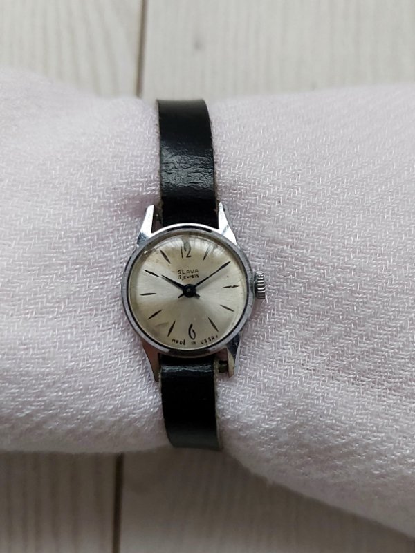 Slava vintage soviet watch with black leather strap.